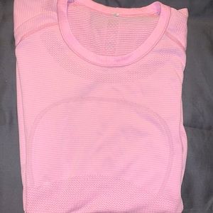 Hot pink Lululemon workout top